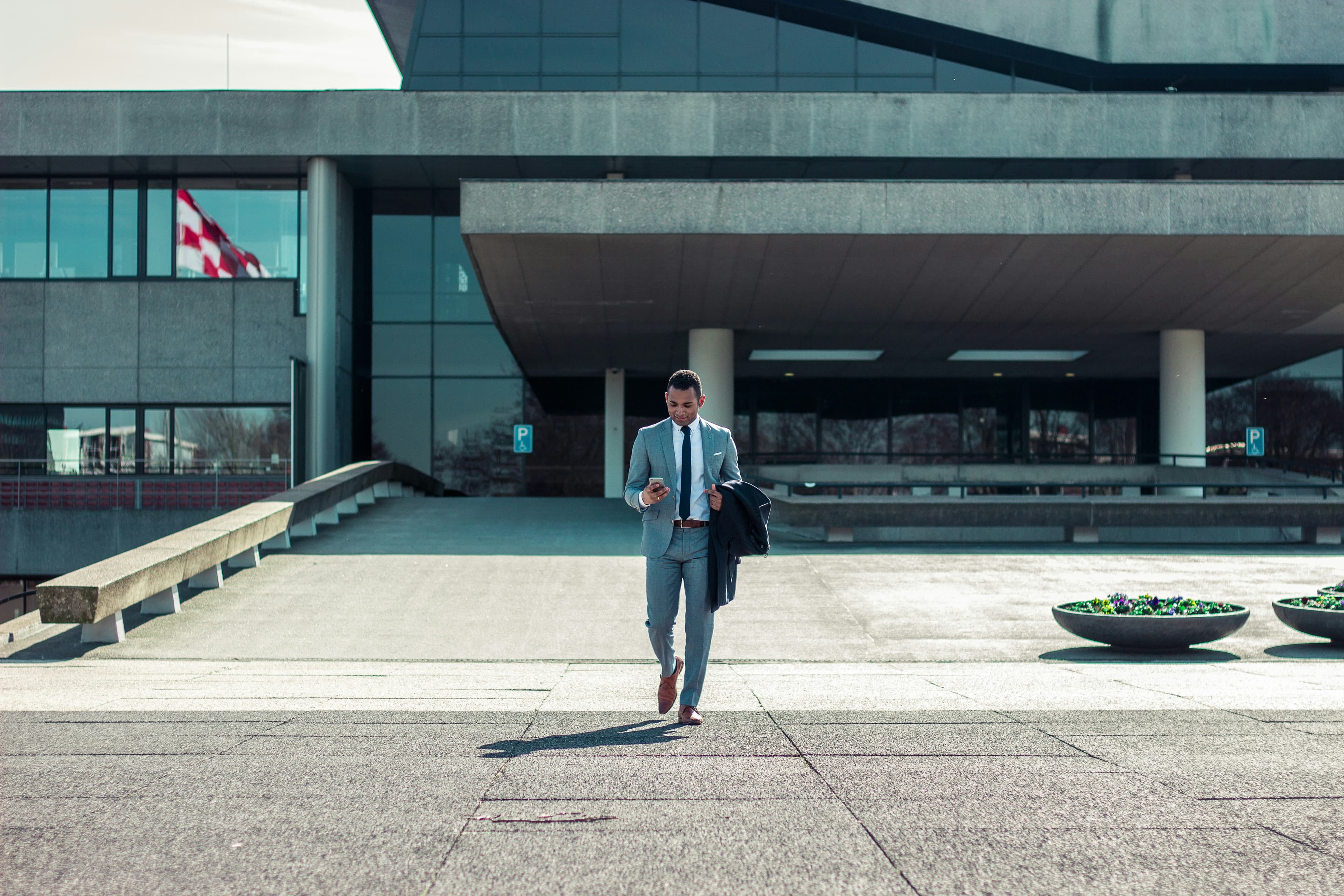 Man in suit looking at phone