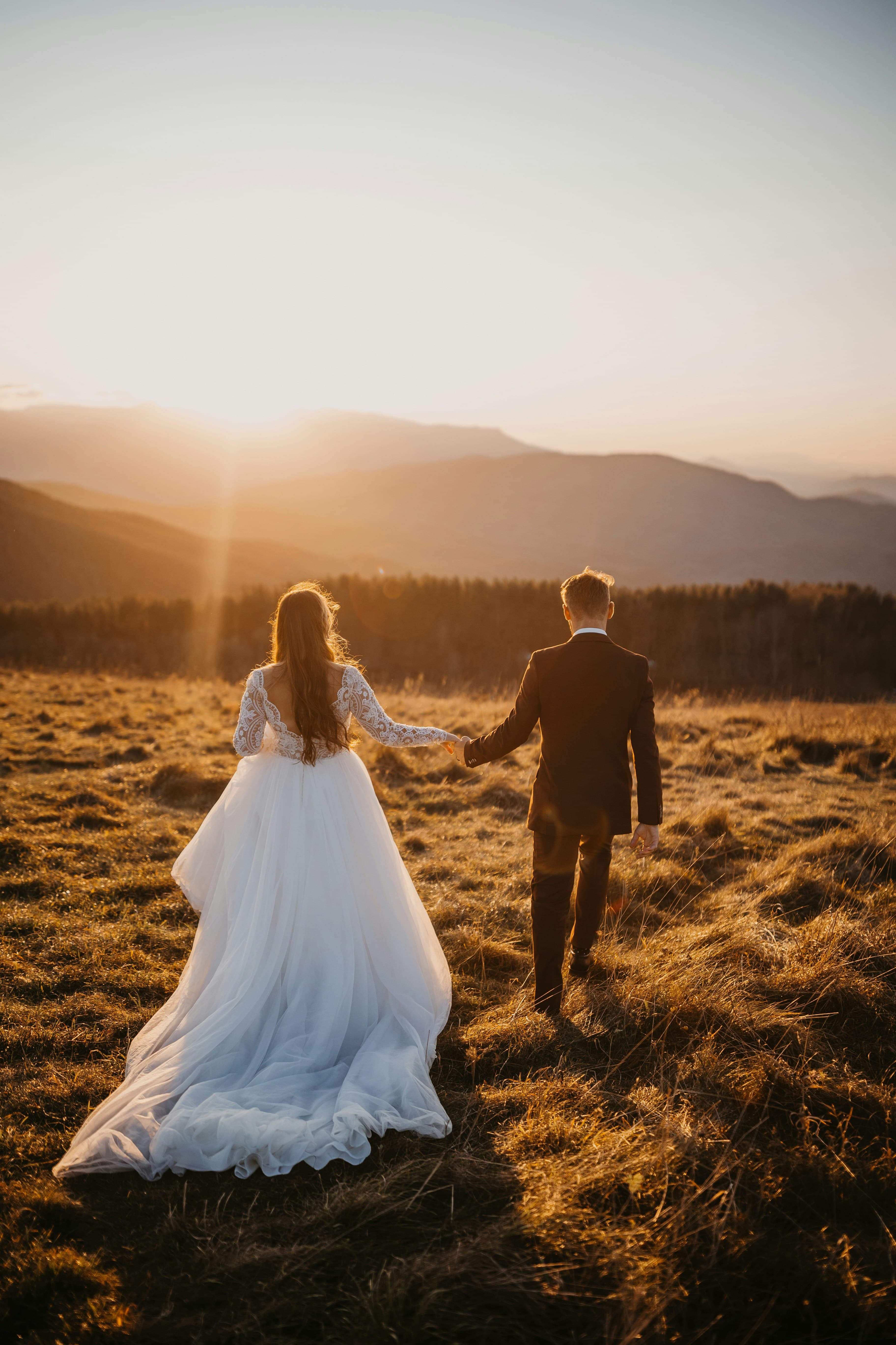 Bride and groom holding hands